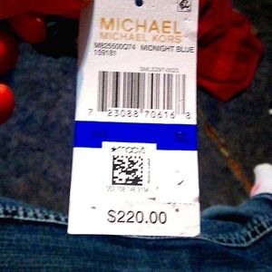 New with tags Michael kors navy blue jacket and bag to carry it